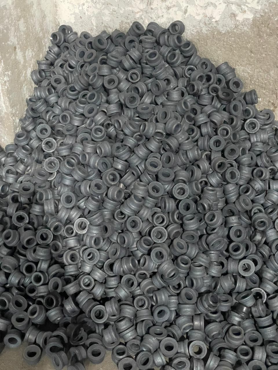 Finished bearing rings organized on inspection pallets inside the plant.