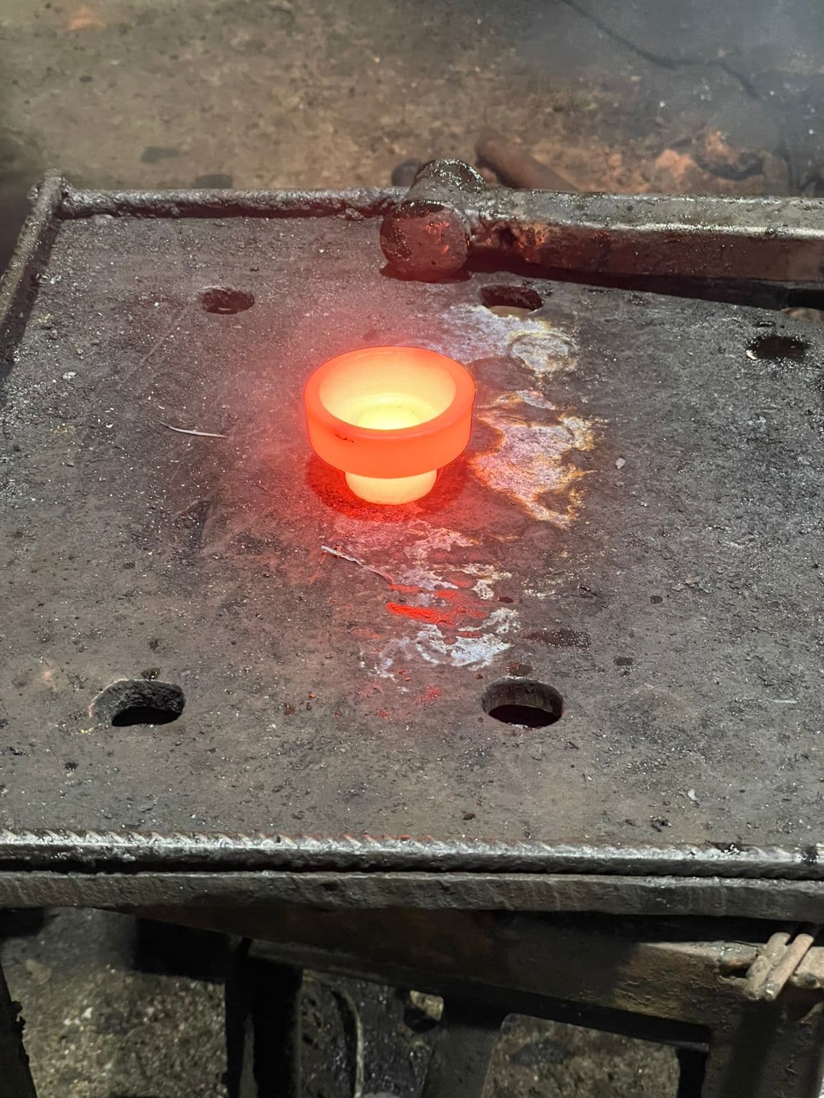 Forged bearing rings stacked in rows awaiting surface finishing.