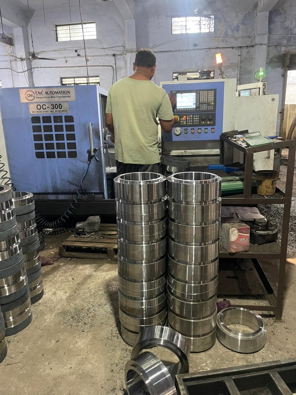 High-volume production of bearing rings loaded on pallets for delivery.
